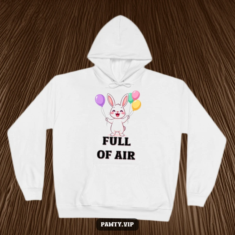 Funny Kawaii rabbit juggling colorful balloons with a wide grin on a cozy hoodie, perfect for comfort.