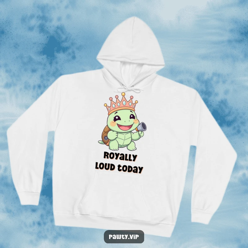 Funny giggling turtle with a glittery crown and noisemaker, featured on a warm hoodie, perfect funny gift.